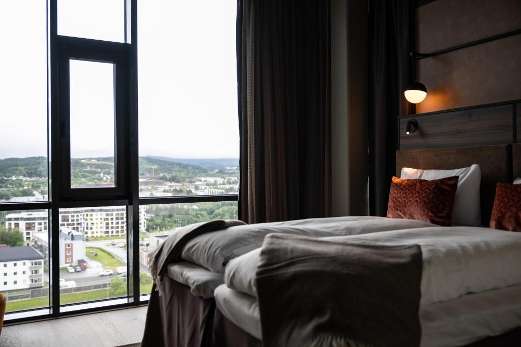 Postel nebo postele na pokoji v ubytování Quality Hotel Panorama