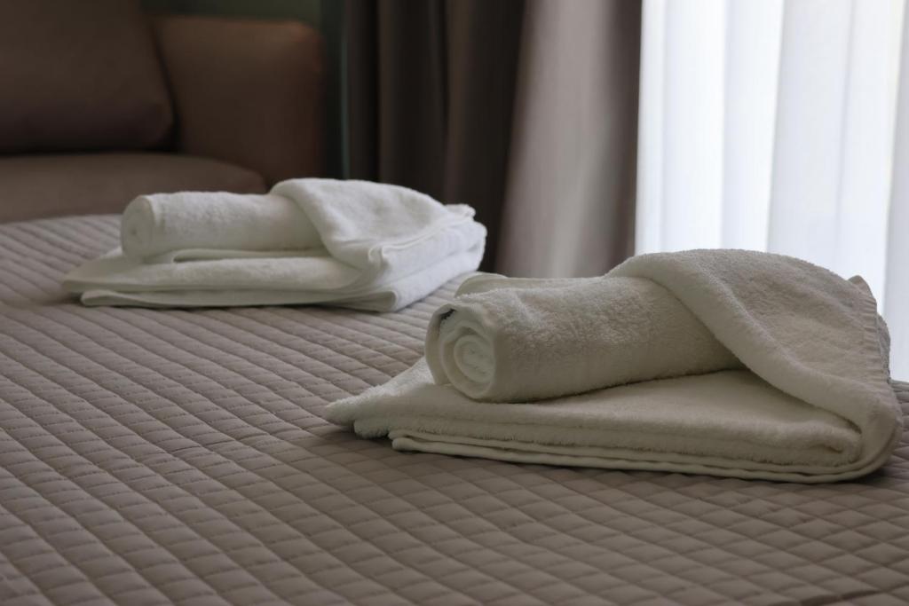 Postel nebo postele na pokoji v ubytování Hotel Porta Ksamil