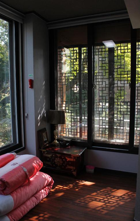 Postel nebo postele na pokoji v ubytování Jiwoljang Guesthouse