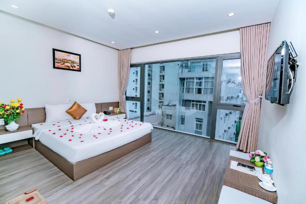 Postel nebo postele na pokoji v ubytování The Shann Hotel Danang