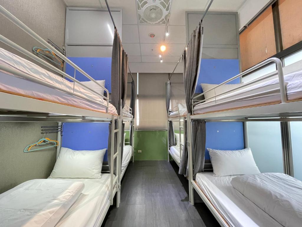 Postel nebo postele na pokoji v ubytování Easymind Guesthouse Taipei Main Station
