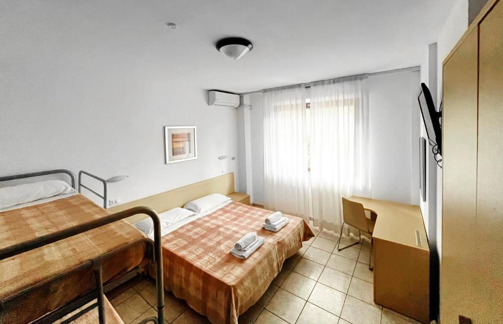 Postel nebo postele na pokoji v ubytování Hotel Rosen Garden