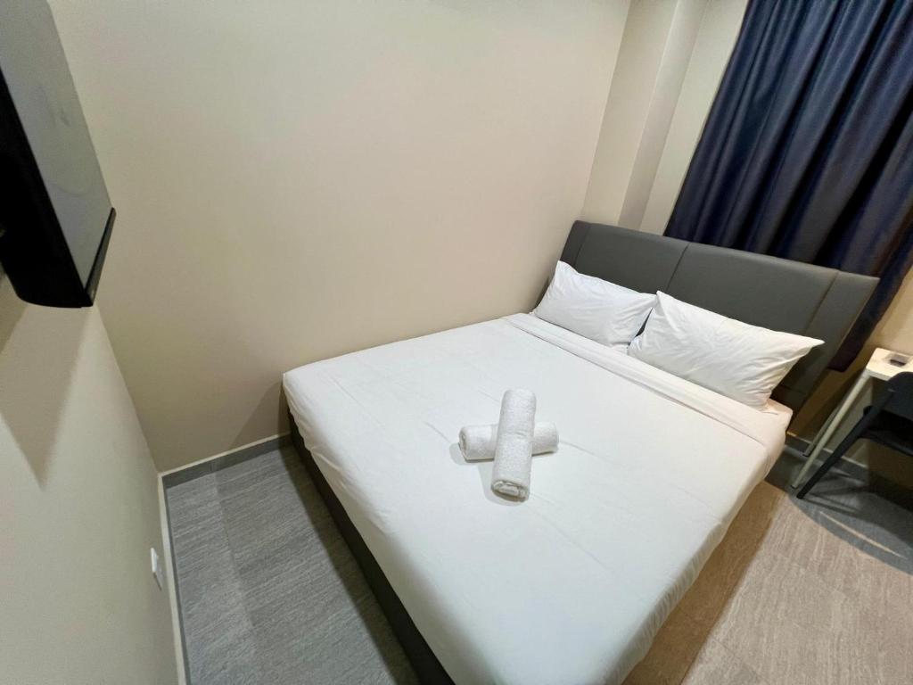 Postel nebo postele na pokoji v ubytování Infinity Hotel Iskandar Puteri
