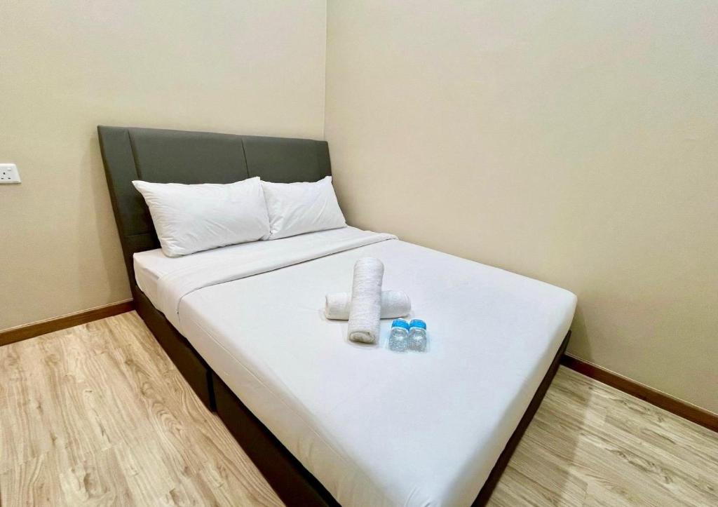 Postel nebo postele na pokoji v ubytování Infinity Hotel Iskandar Puteri