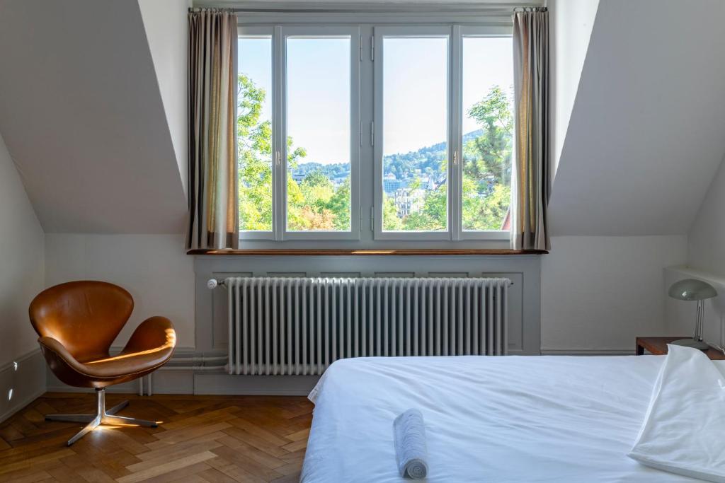 Postel nebo postele na pokoji v ubytování Militärkantine St. Gallen