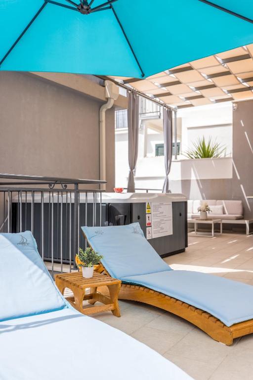 Postel nebo postele na pokoji v ubytování Villa Maya