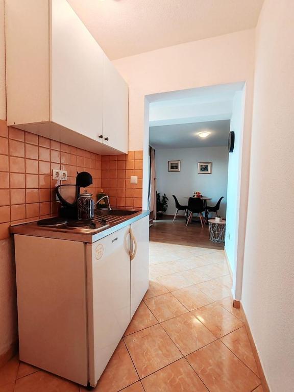 Kuchyň nebo kuchyňský kout v ubytování Apartments Amare