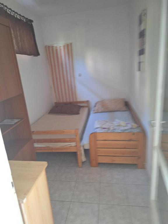 Postel nebo postele na pokoji v ubytování Családi Apartman Badacsonytomaj