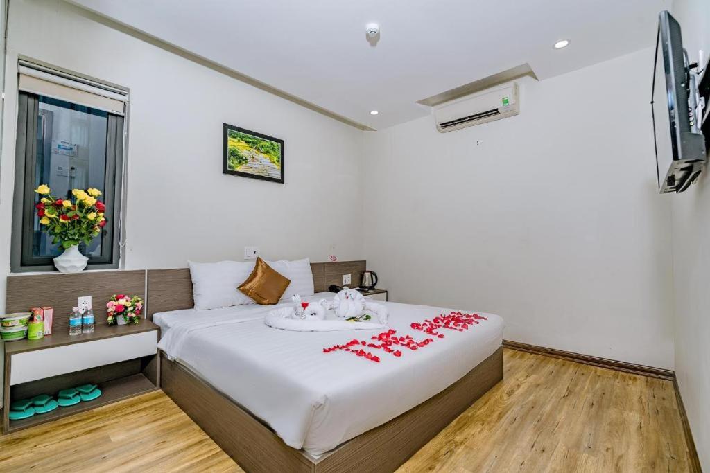 Postel nebo postele na pokoji v ubytování The Shann Hotel Danang