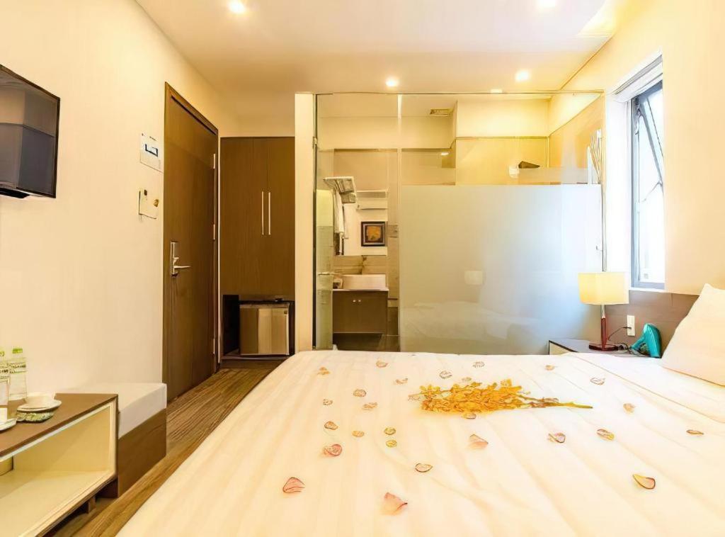 Postel nebo postele na pokoji v ubytování The Shann Hotel Danang