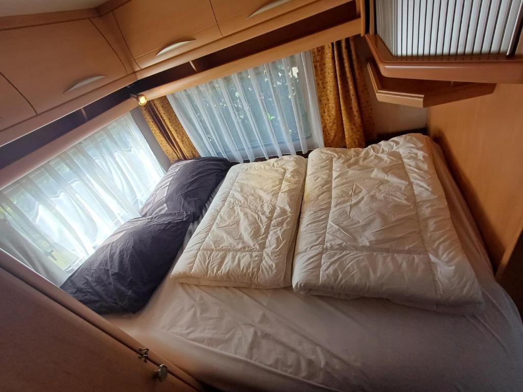 Postel nebo postele na pokoji v ubytování Caravan Petiet
