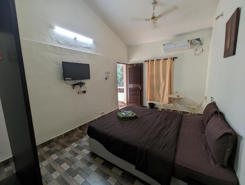 Een TV en/of entertainmentcenter bij Vinsons Cottages
