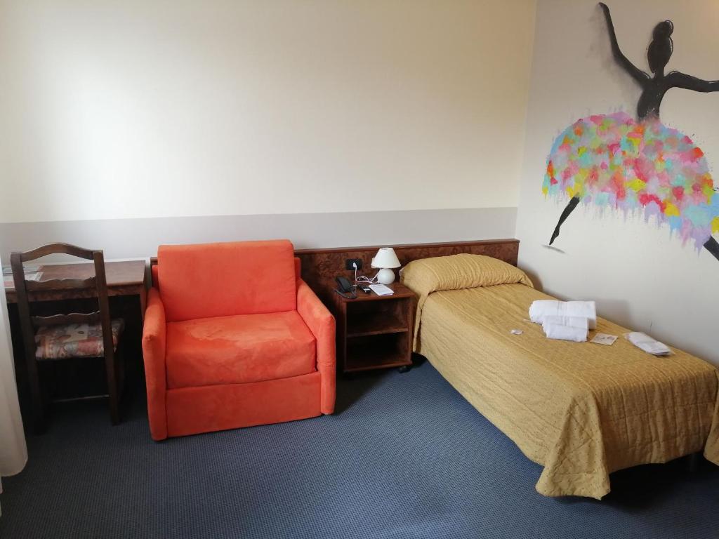 Postel nebo postele na pokoji v ubytování Hotel Siros
