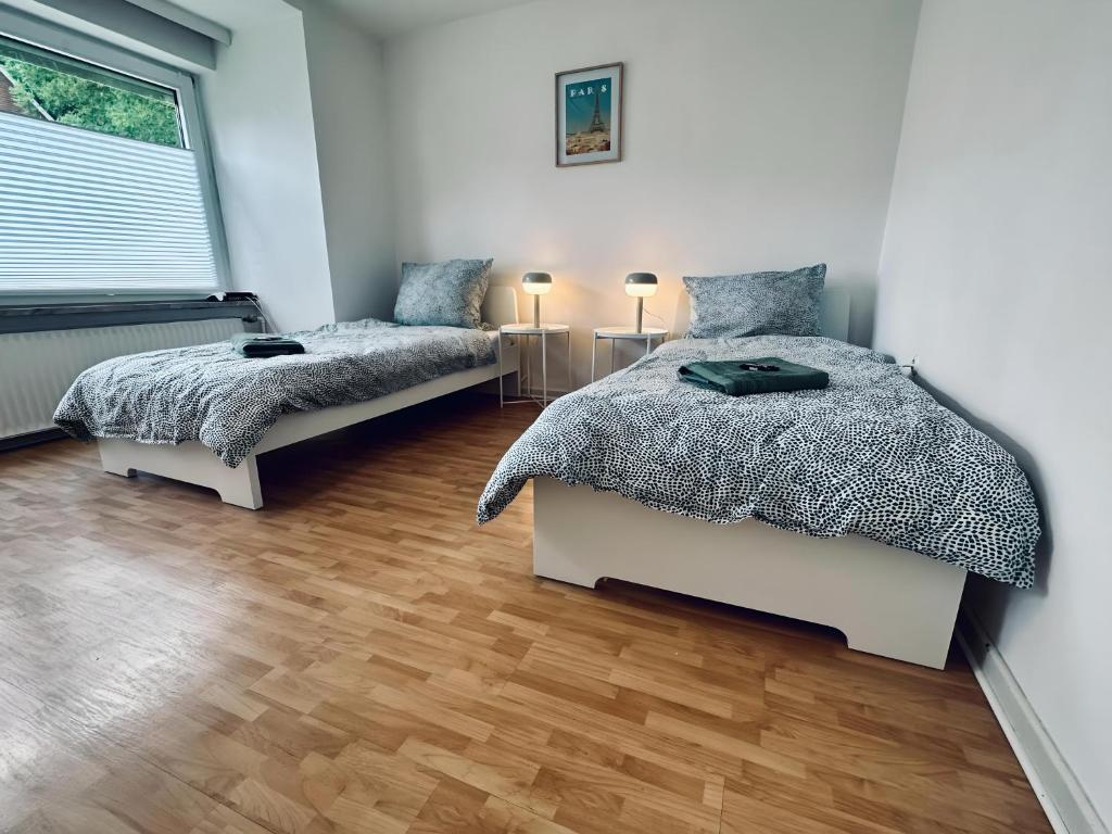 Ένα ή περισσότερα κρεβάτια σε δωμάτιο στο Apartment NeuenHOUSE I Garten & Ruhig