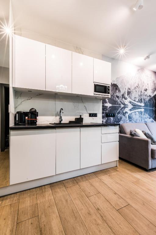 Kuchyňa alebo kuchynka v ubytovaní Apartamenty Royal Resort Spa