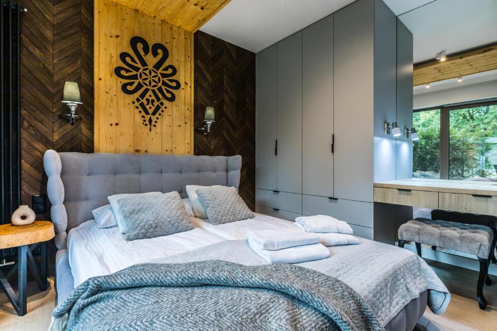 Posteľ alebo postele v izbe v ubytovaní Apartamenty Royal Resort Spa