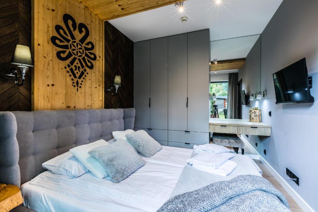 Posteľ alebo postele v izbe v ubytovaní Apartamenty Royal Resort Spa