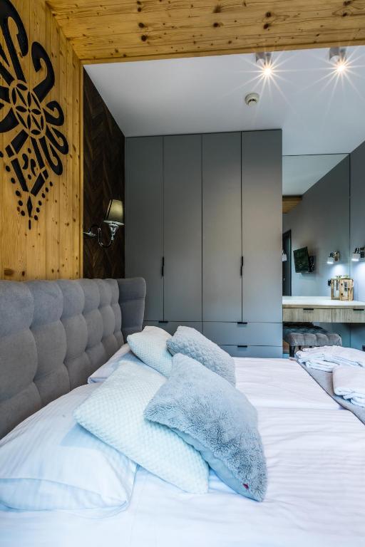 Posteľ alebo postele v izbe v ubytovaní Apartamenty Royal Resort Spa