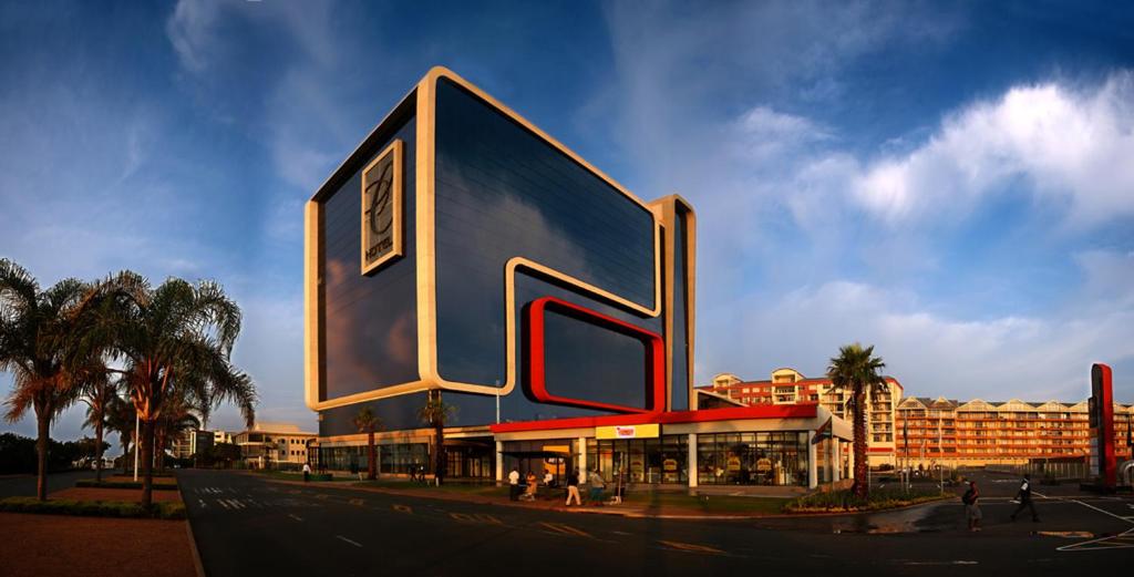 a large building with a large letter on the side of it at Coastlands Umhlanga Hotel and Convention Centre in Durban