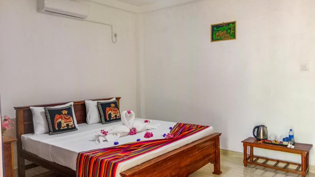 Postel nebo postele na pokoji v ubytování Gimhana Homestay