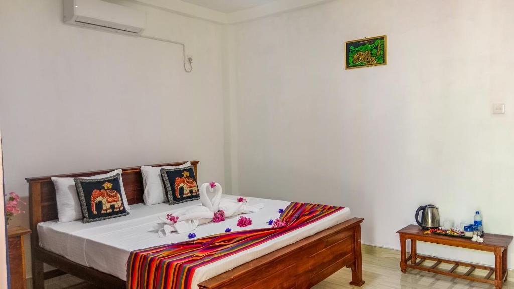 Postel nebo postele na pokoji v ubytování Gimhana Homestay
