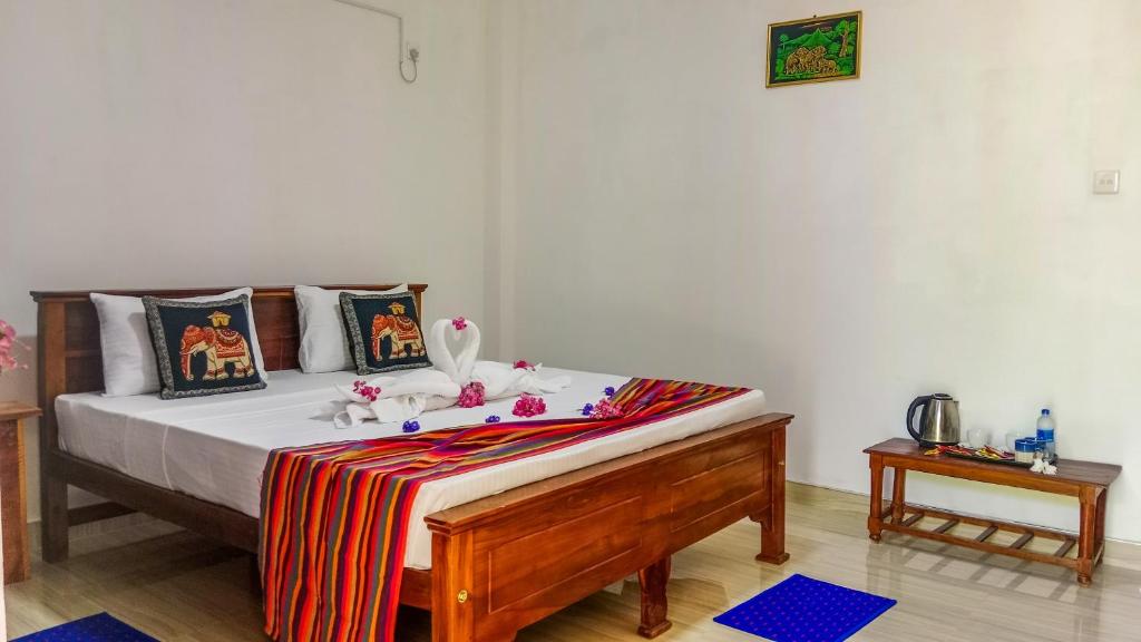 Postel nebo postele na pokoji v ubytování Gimhana Homestay