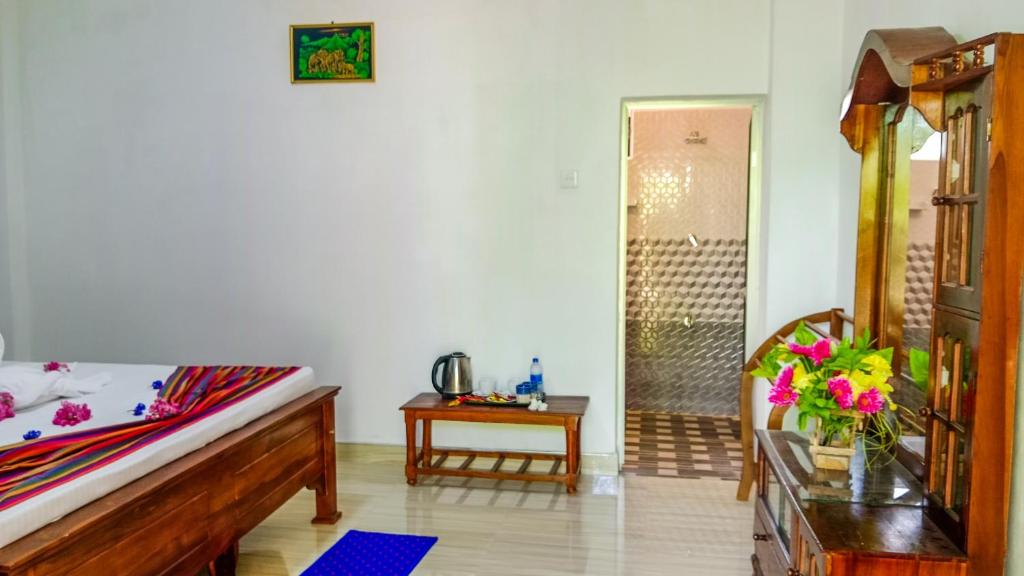 Postel nebo postele na pokoji v ubytování Gimhana Homestay