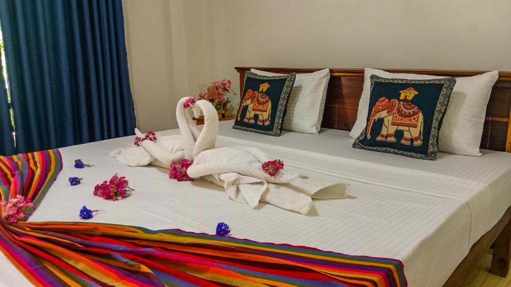Postel nebo postele na pokoji v ubytování Gimhana Homestay