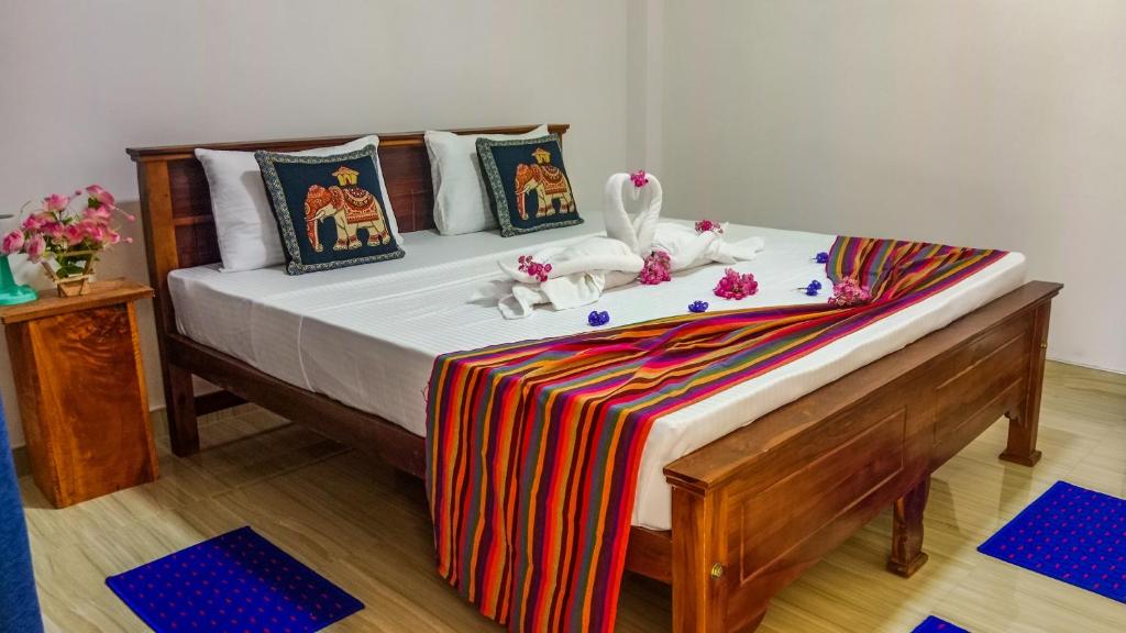 Postel nebo postele na pokoji v ubytování Gimhana Homestay
