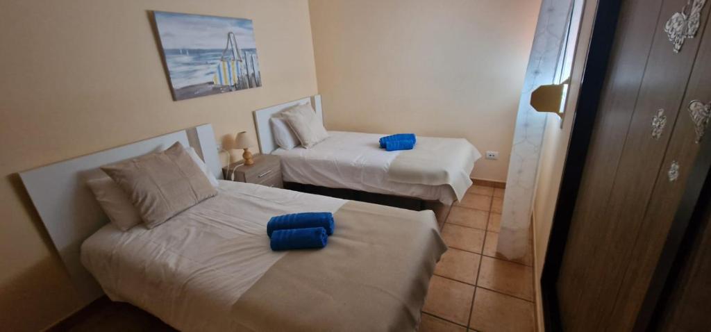 A bed or beds in a room at Apartamento vacacional Fuerteventura 1A