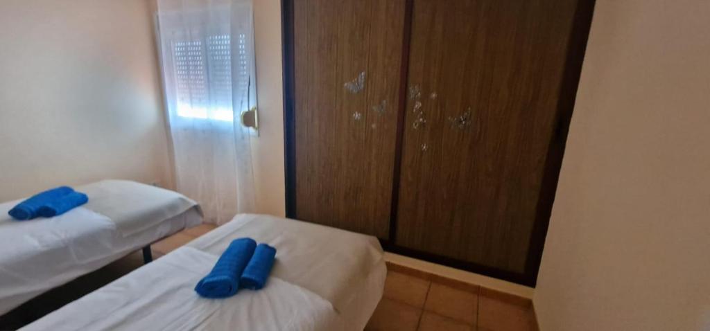 A bed or beds in a room at Apartamento vacacional Fuerteventura 1A