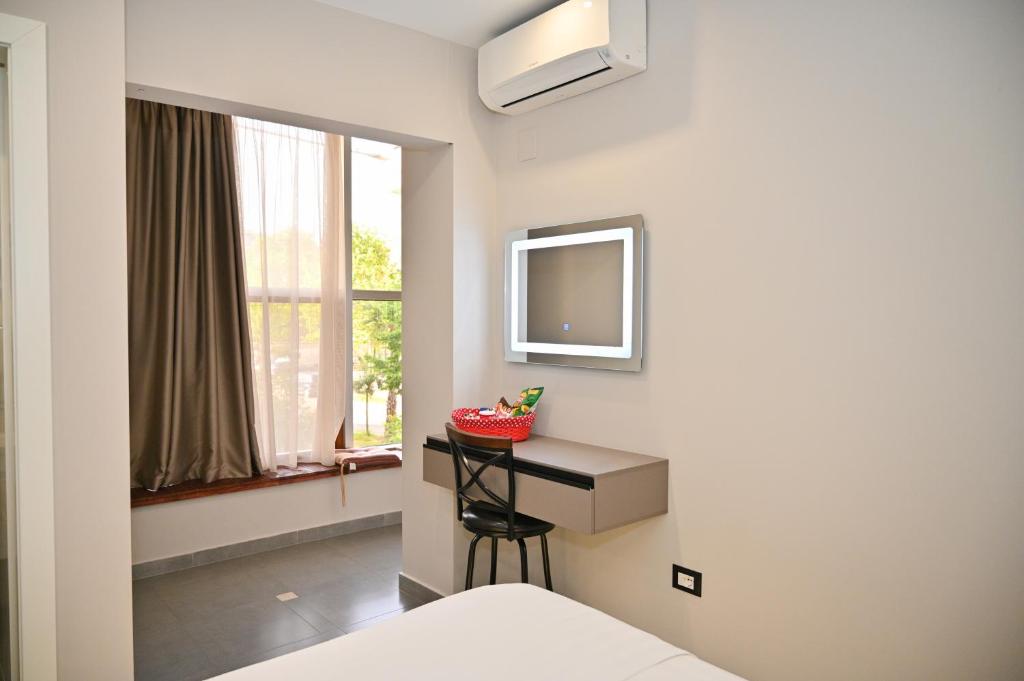 TV a/nebo společenská místnost v ubytování Hotel Vila Emes