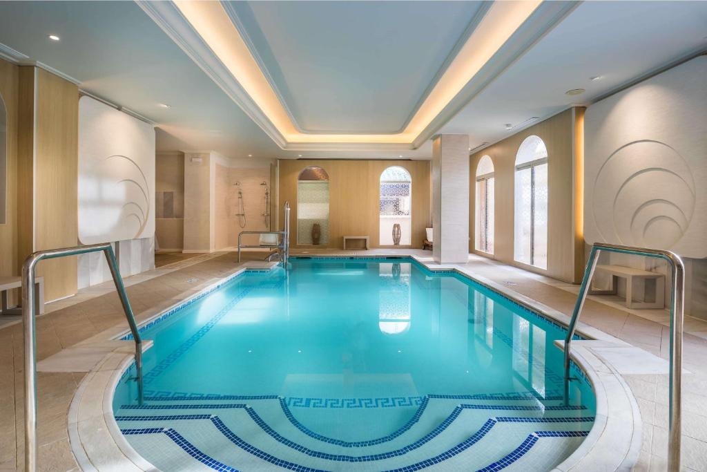 a swimming pool in a building with a ceiling at Barceló Isla Canela in Isla Canela