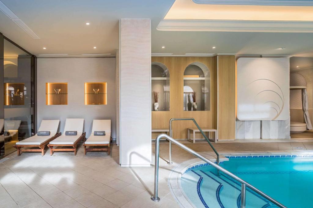 a pool in a hotel room with a swimming pool at Barceló Isla Canela in Isla Canela