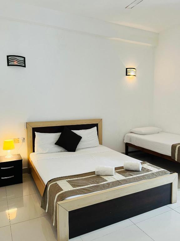Postel nebo postele na pokoji v ubytování Hotel Blue Bird