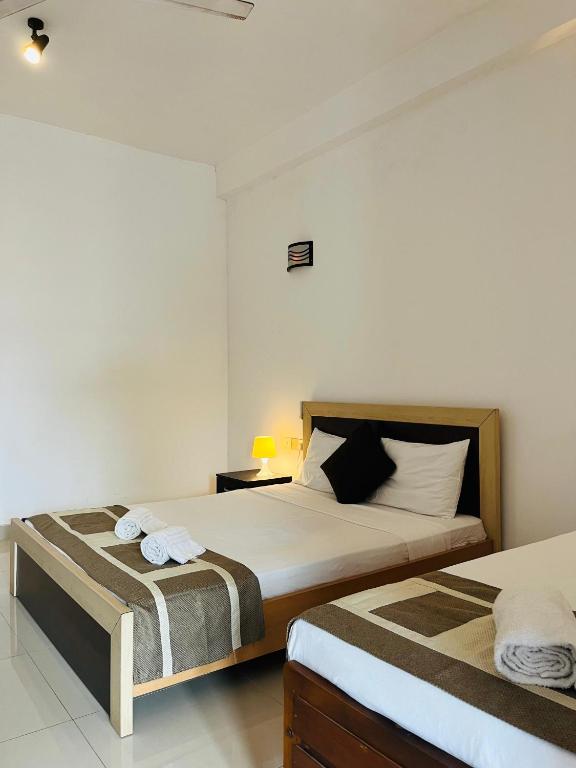 Postel nebo postele na pokoji v ubytování Hotel Blue Bird