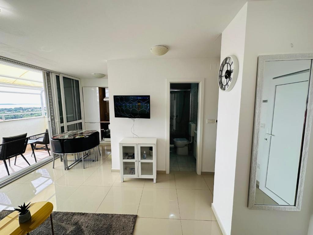 Televízia a/alebo spoločenská miestnosť v ubytovaní Luxury apartment CityZen