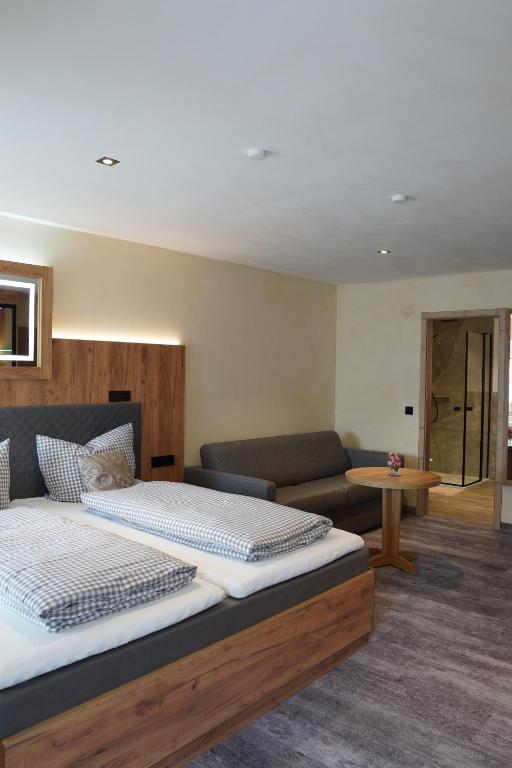 Postel nebo postele na pokoji v ubytování Hotel Heideparadies