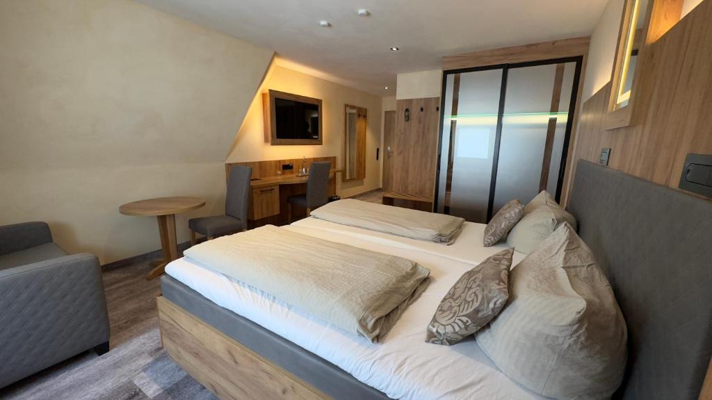 Postel nebo postele na pokoji v ubytování Hotel Heideparadies
