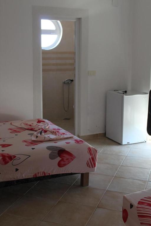 Postel nebo postele na pokoji v ubytování Apartments Luana