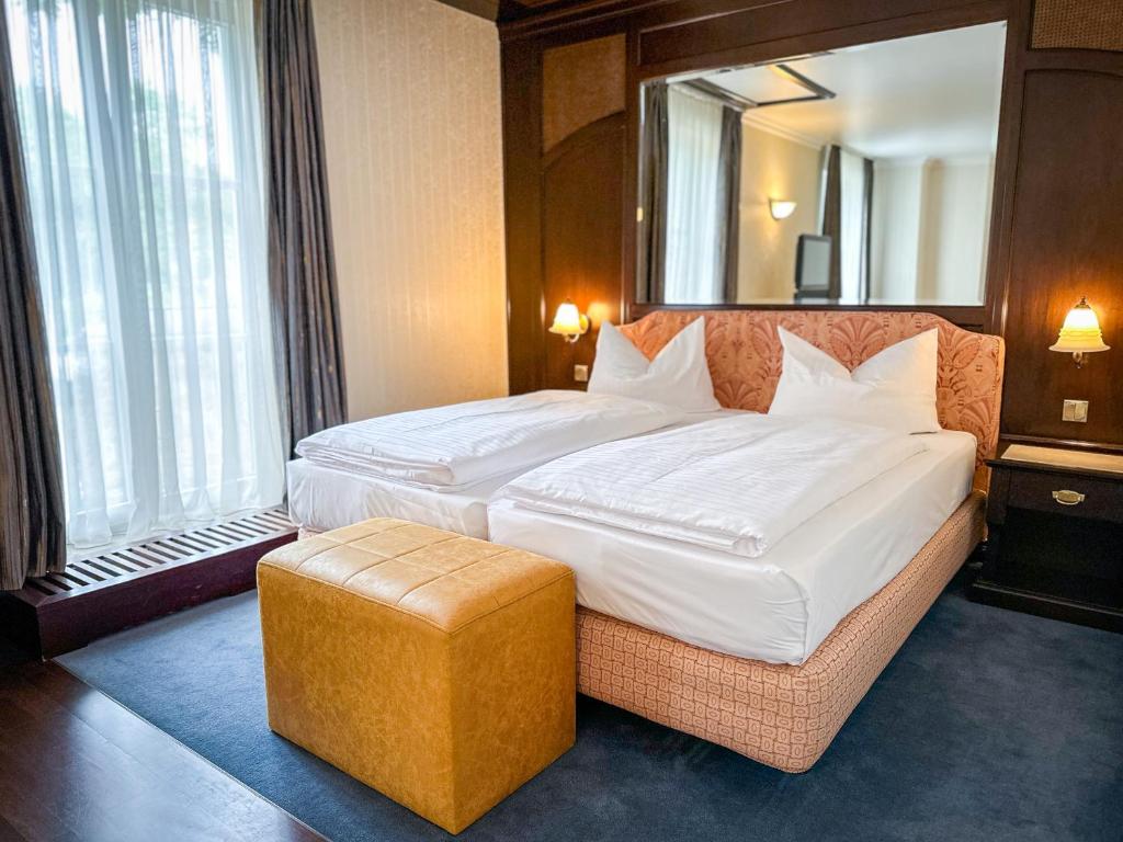 Postel nebo postele na pokoji v ubytování Weltemühle Hotel by Miri's Dresden