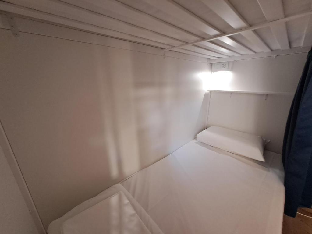 Postel nebo postele na pokoji v ubytování Tilia Hostel