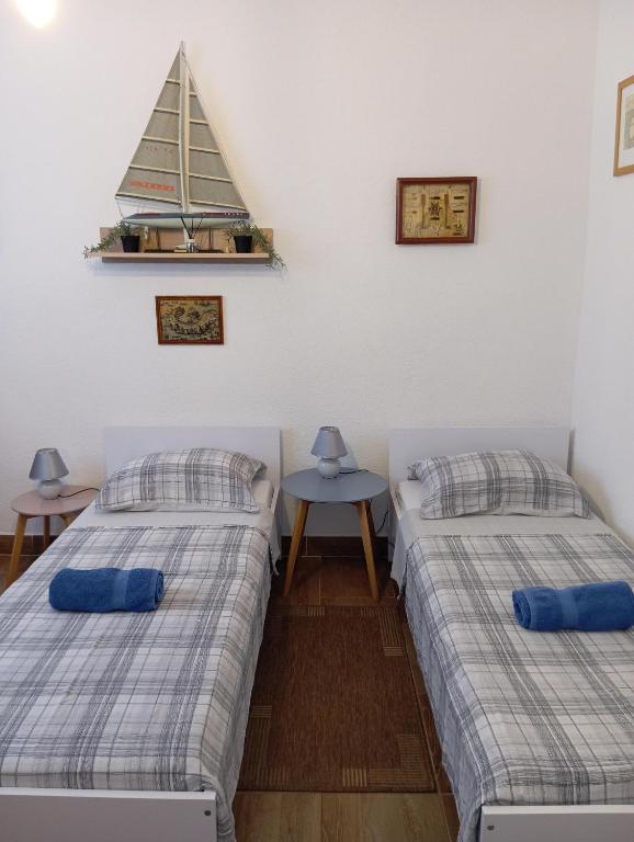 Postel nebo postele na pokoji v ubytování Adriatica Apartments