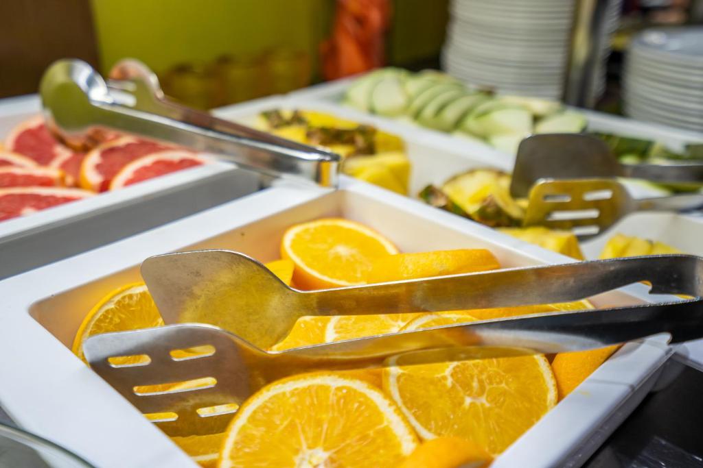 a tray of orange slices and spoons at Abba Rambla Hotel in Barcelona