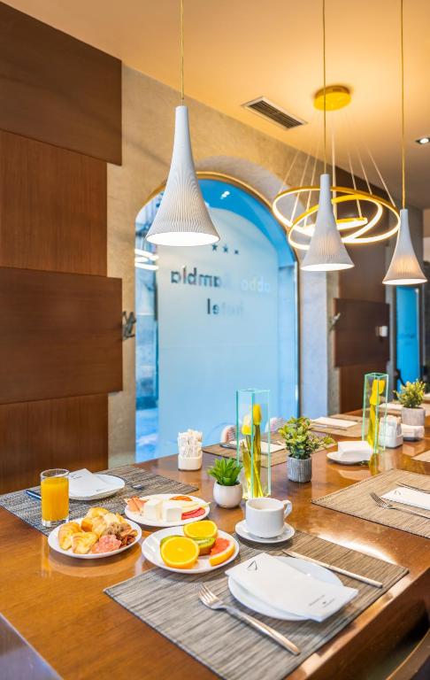 a table with plates of food on top of it at Abba Rambla Hotel in Barcelona