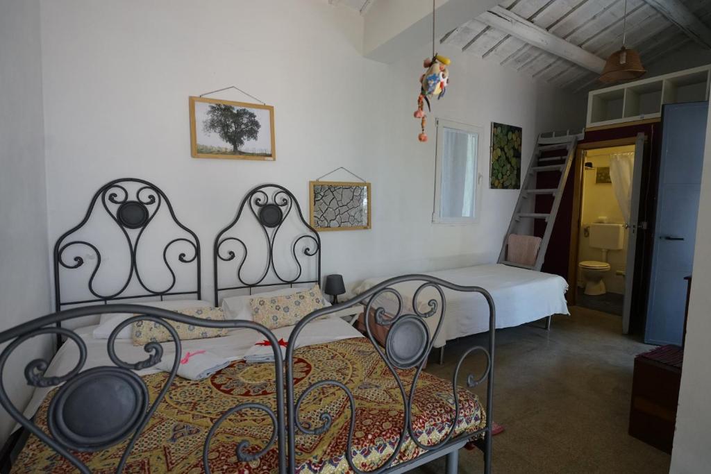 Postel nebo postele na pokoji v ubytování PODERE Sant'ANNA B&B - Chalet tra le vigne