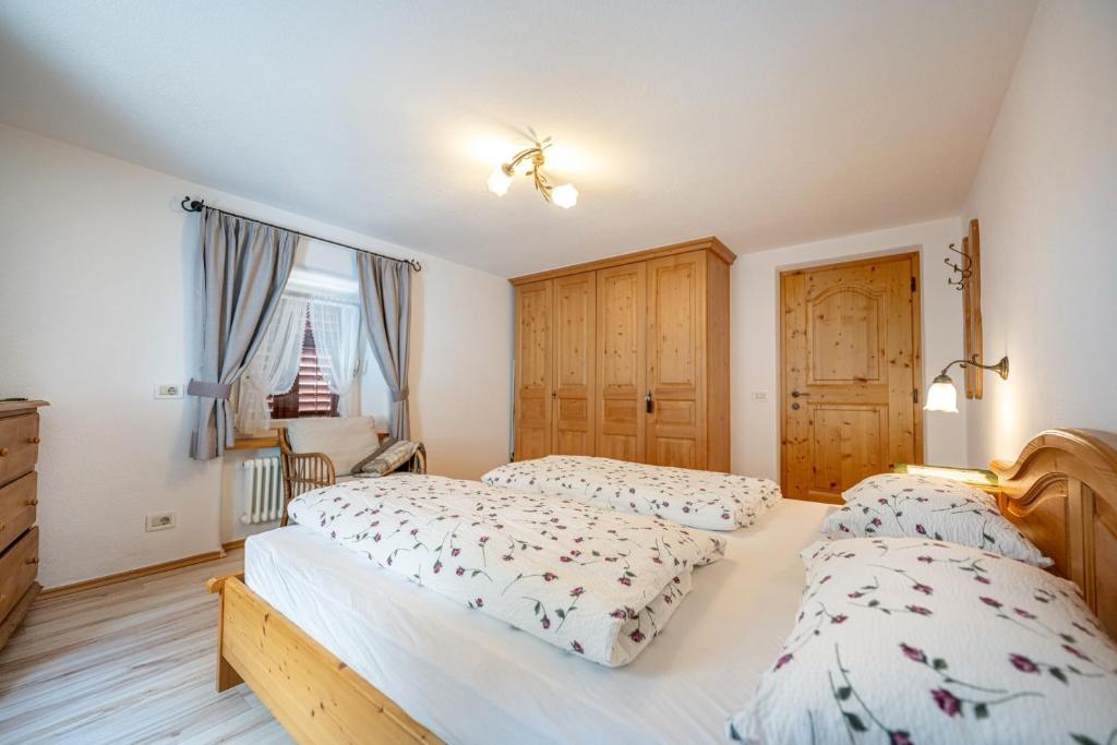 A bed or beds in a room at Apartments Smidl