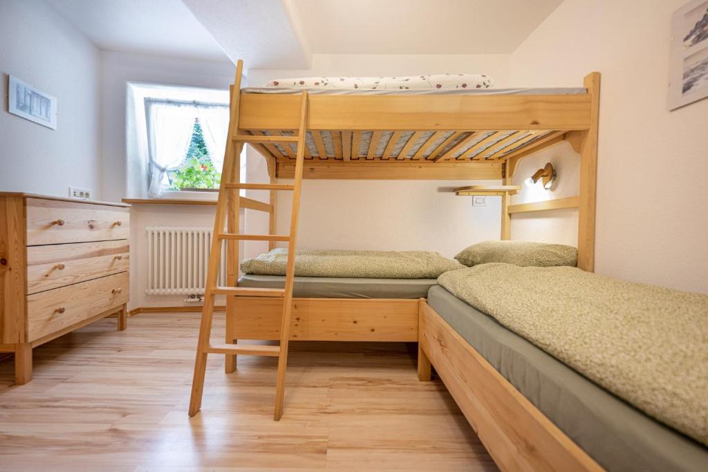 A bed or beds in a room at Apartments Smidl