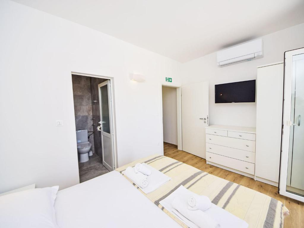 Posteľ alebo postele v izbe v ubytovaní Apartment Balota - Moreška-1 by Interhome