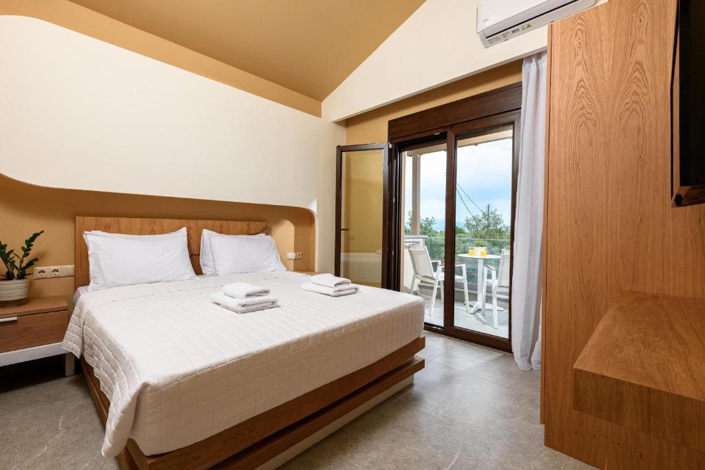 Postel nebo postele na pokoji v ubytování Olea Luxury Villa